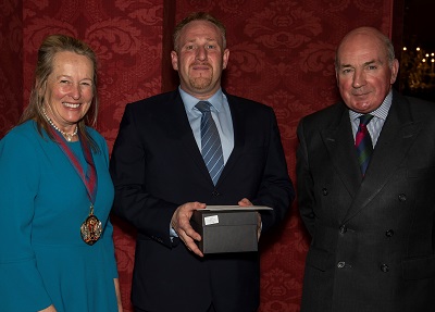Ryan receiving his Award from Worshipful Master Pippa Latham and Lord Dannatt